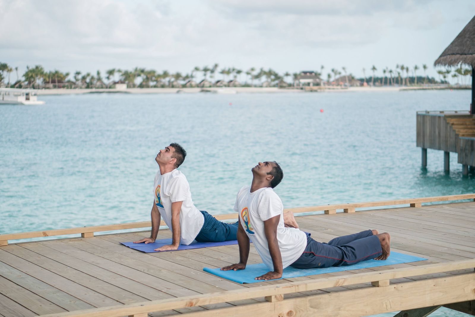Private yoga session on a tropical oceanfront deck