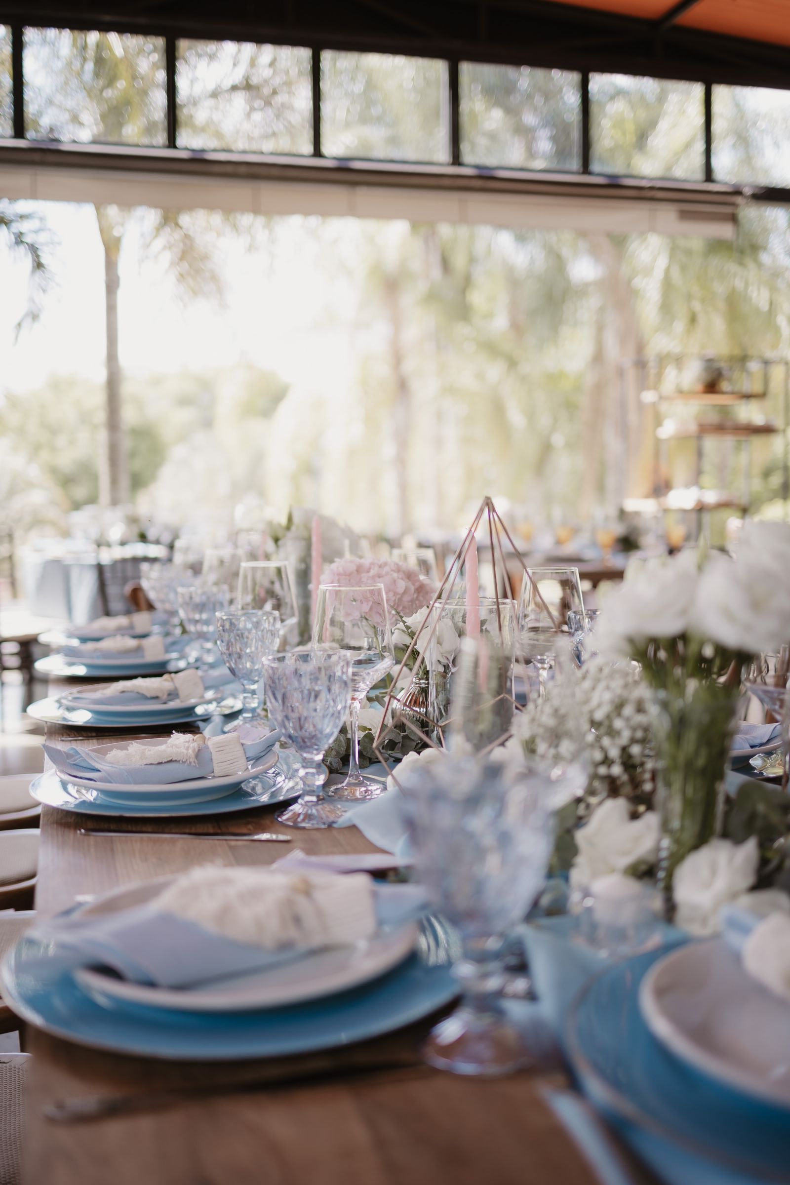 Elegant outdoor table with flowers and place settings