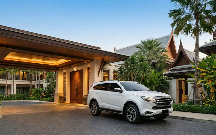 The private transfer SUV waiting at the hotel entrance