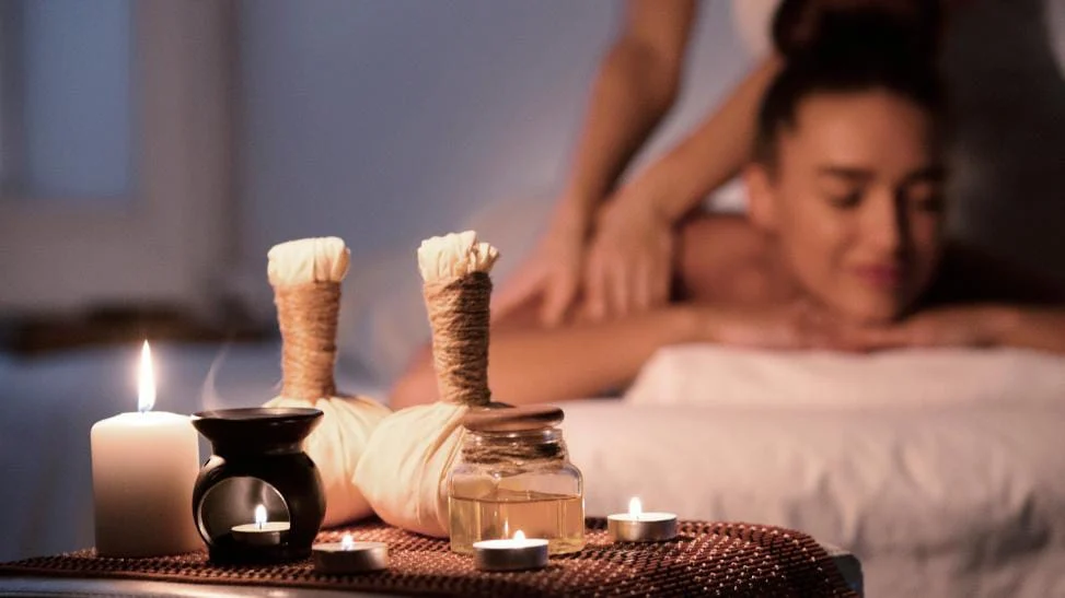 Candlelit massage treatment with aromatic oils