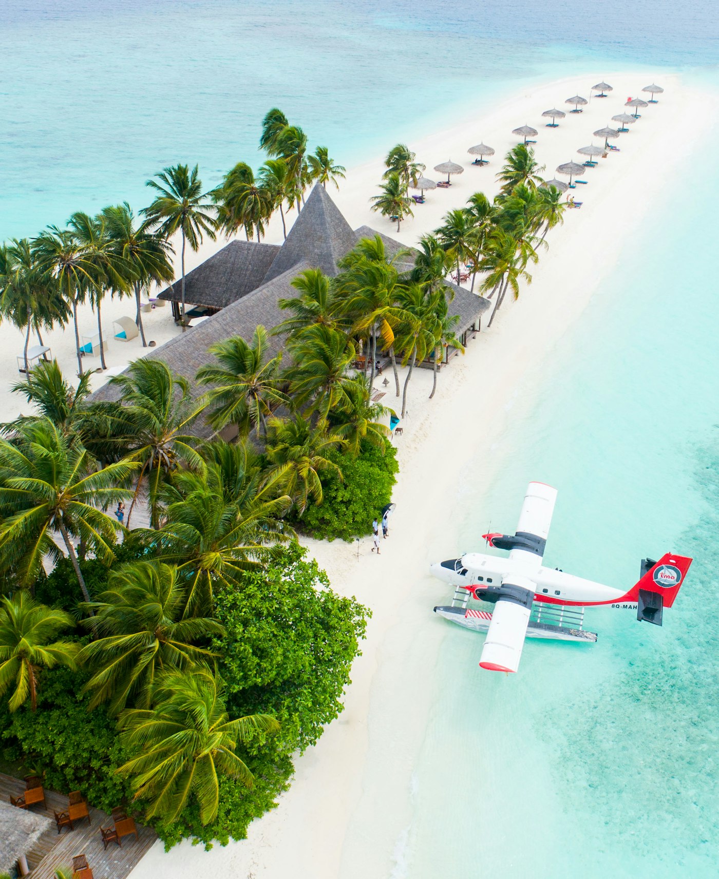 Seaplane flying over the tropical coastline