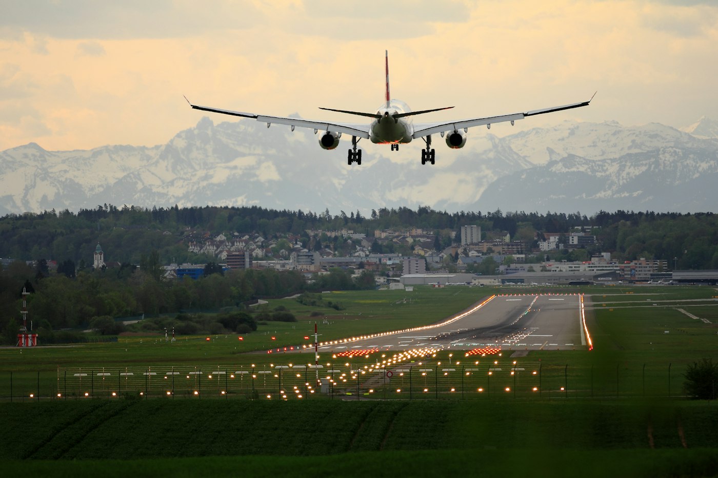 Plane touching down at sunset at San José airport